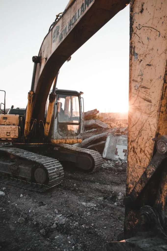 Heavy machinery at a construction site at sunset, showcasing industrial strength and raw power.